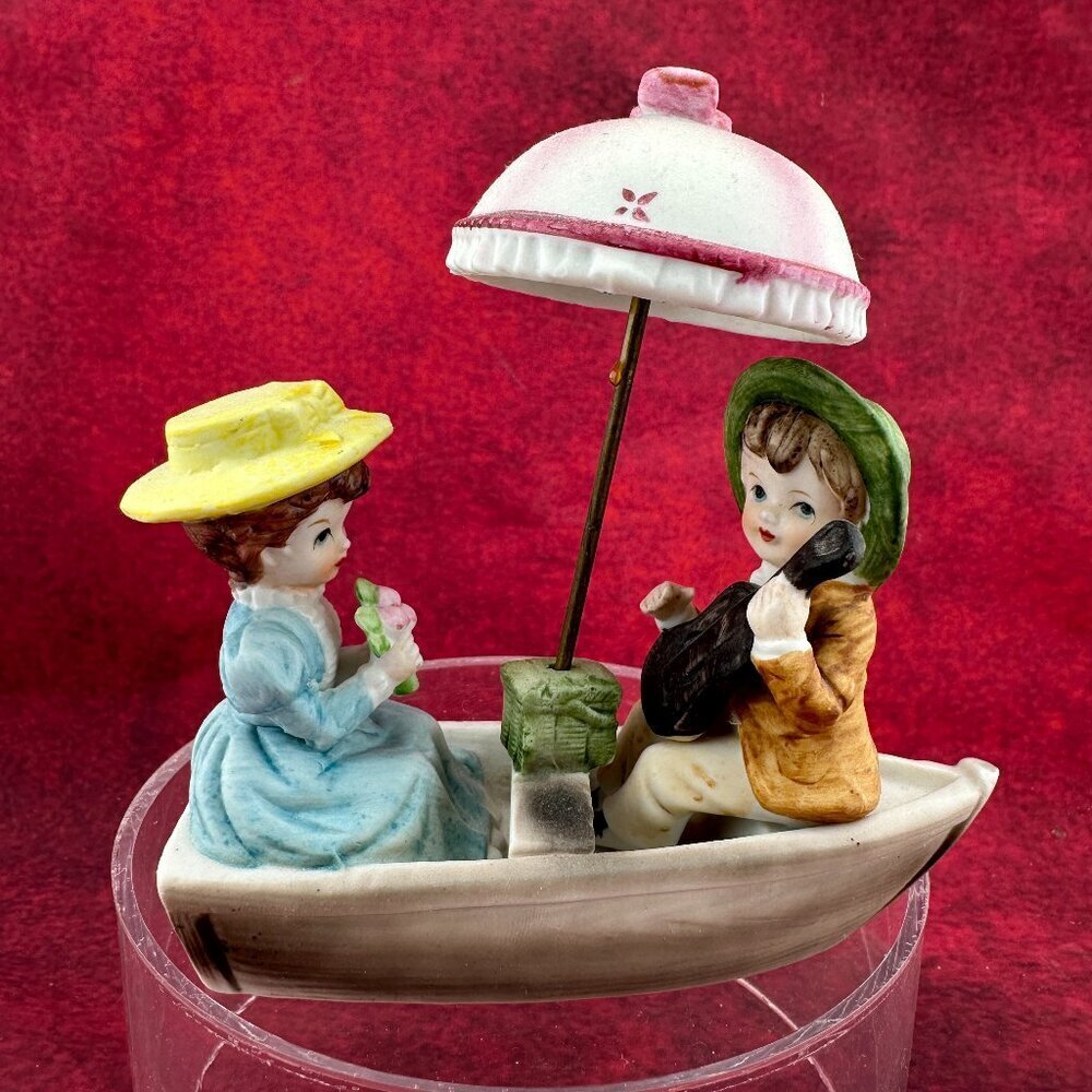 VTG 1960's LEGO BOY AND GIRL IN BOAT w/UMBRELLA, PORCELAIN FIGURINE